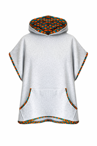 Light gray poncho with colorful geometric pattern on hood and trim on a white background