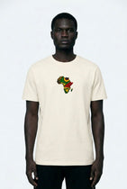 Person wearing a white t-shirt with a colorful graphic design on a plain background