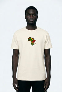 Person wearing a white t-shirt with a colorful graphic design on a plain background