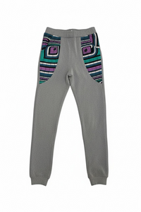 Gray sweatpants with colorful geometric patterns on a white background
