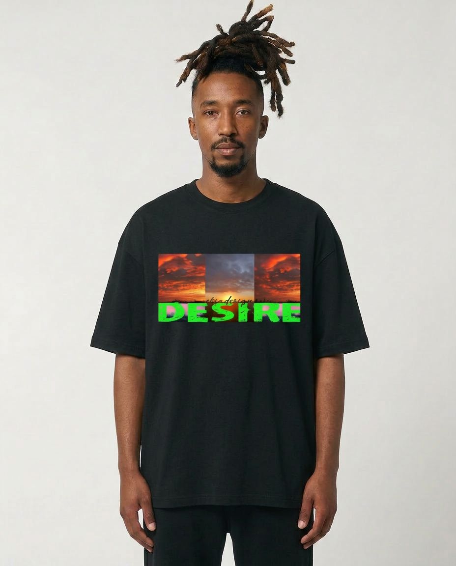 Man wearing a black t-shirt with a colorful graphic and text on a plain background