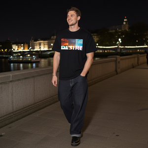 Man walking on a bridge at night with city lights in the background