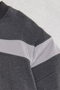 Gray and white color-blocked fabric texture on a gray background