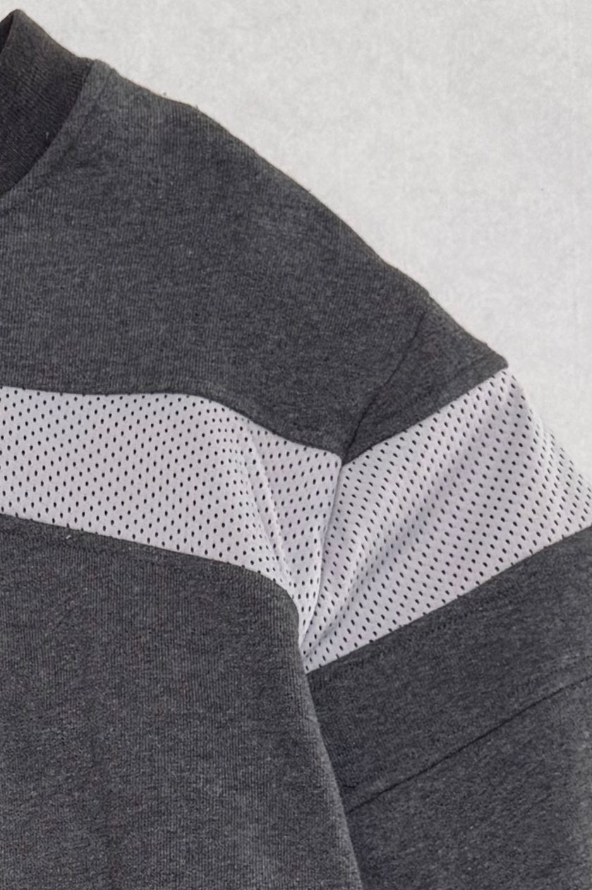Gray and white color-blocked fabric texture on a gray background
