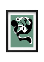 Framed abstract artwork with black and white design on a green background