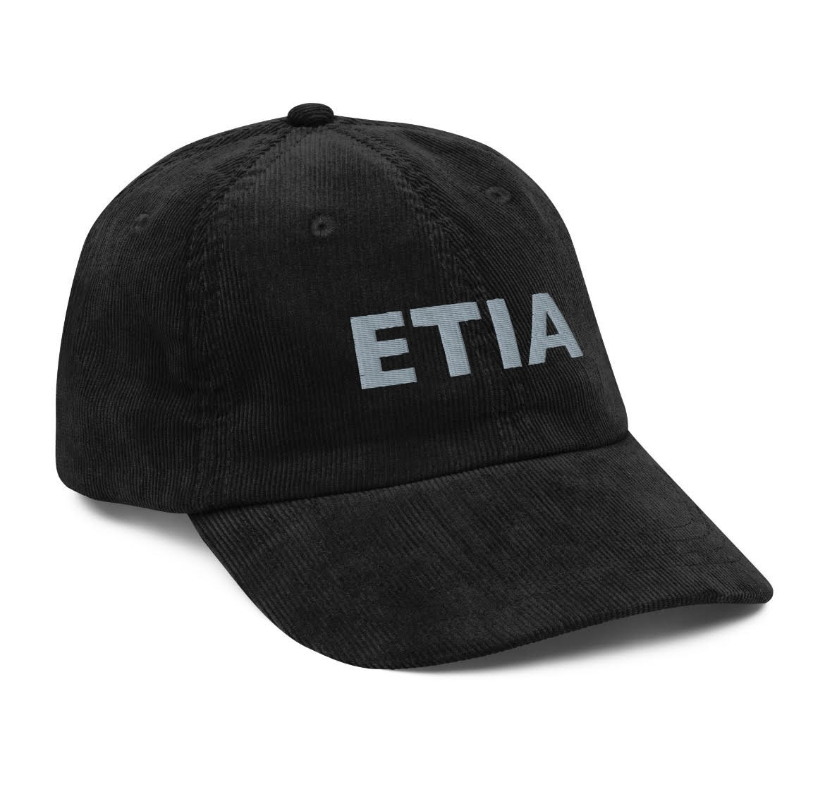 A black corduroy cap with the text 'ETIA' embroidered on the front.