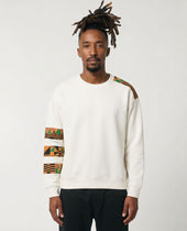 Man wearing a white sweatshirt with colorful arm patterns on a plain background