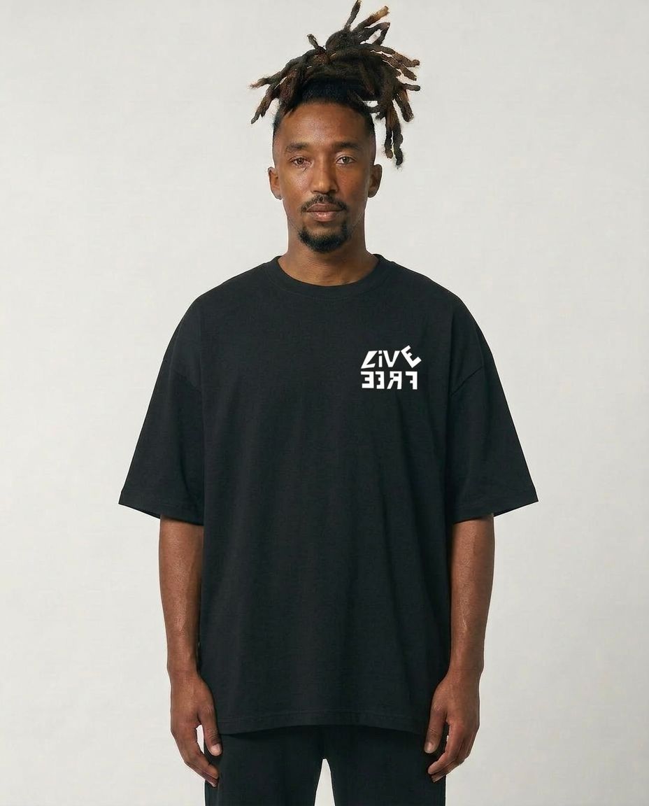 Man wearing a black t-shirt with a logo on a plain background