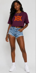 Model wearing Cotton quality cropped mulberry colour top | blue denim jeans and white trainers. 