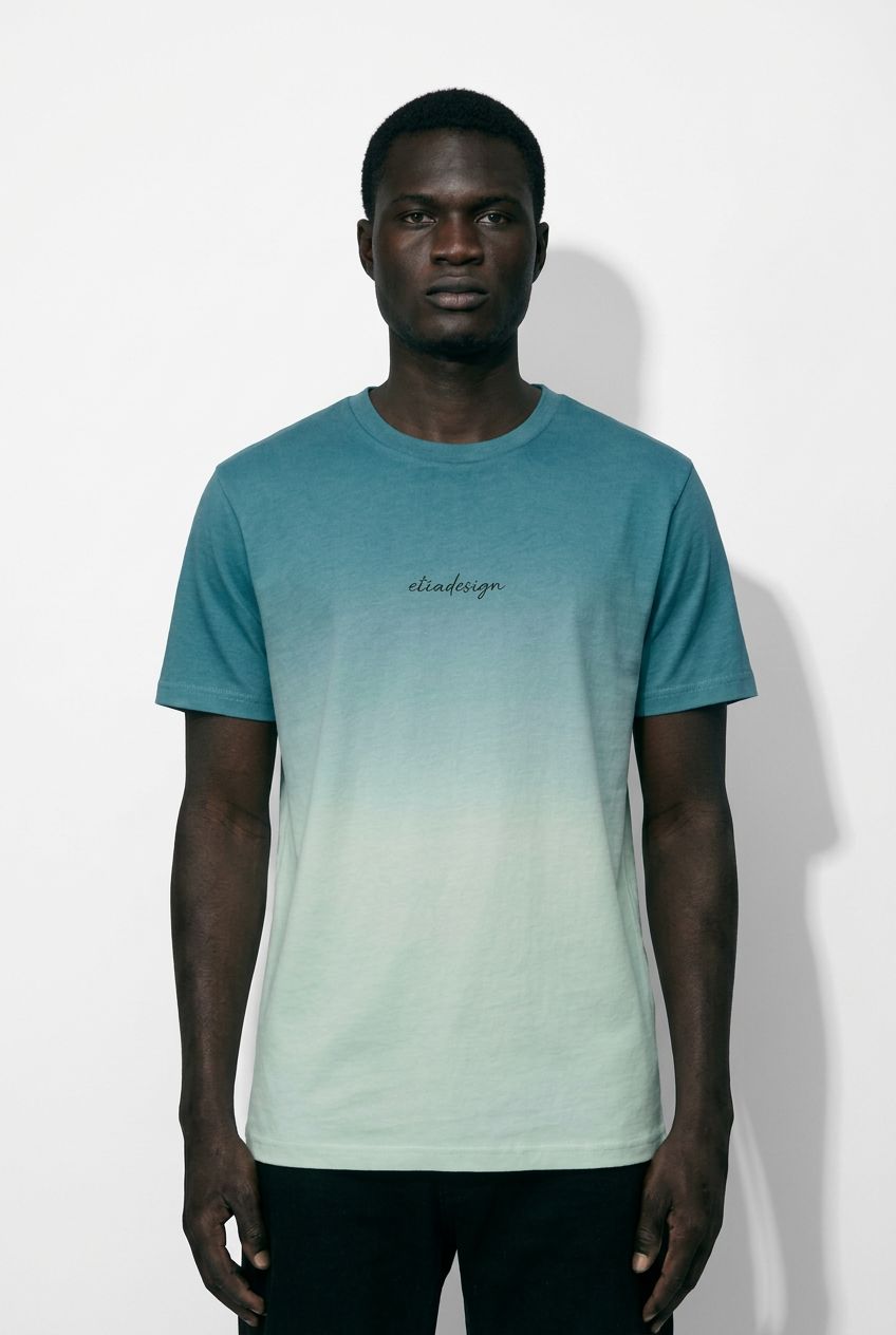 Man wearing a gradient t-shirt with 'elindesign' logo against a white background