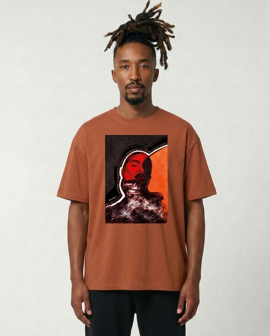 Man wearing a brown t-shirt with a graphic design on a plain background