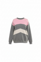 Color-blocked sweater with gray, pink, and beige design on a white background
