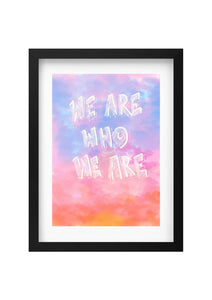 Framed artwork with 'We are who we are' text on a colorful watercolor background