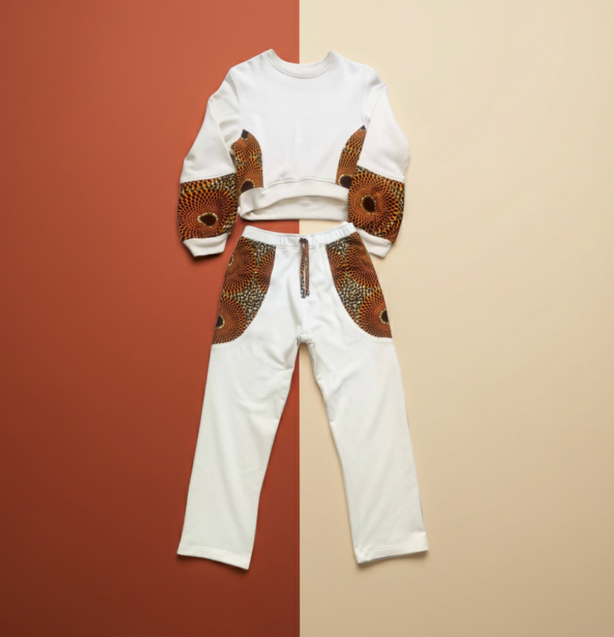 White outfit with brown pattern on a two-tone background