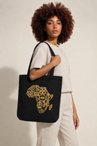 Adinkra tote carried by a model