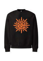 Black sweatshirt with an orange sun design on a white background
