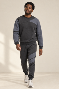 Grey-on-grey tracksuit with a relaxed walking pose
