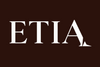 WHITE 'ETIA' logo on a BROWN background